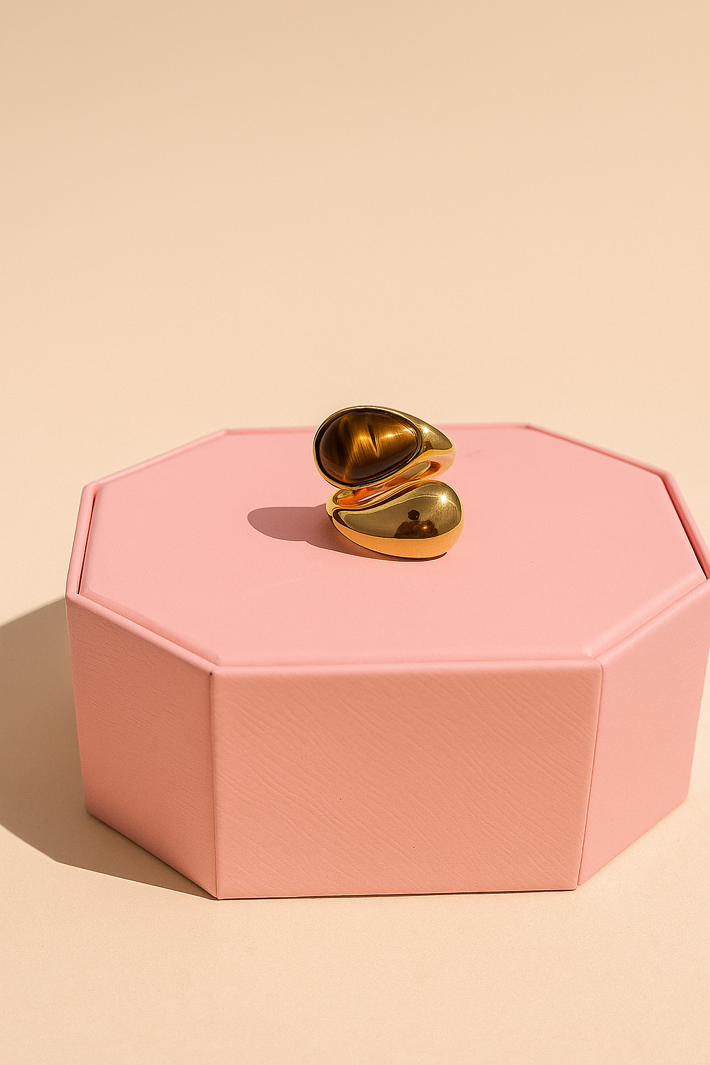 Close-up of Sienna Ring worn on hand against white backdrop