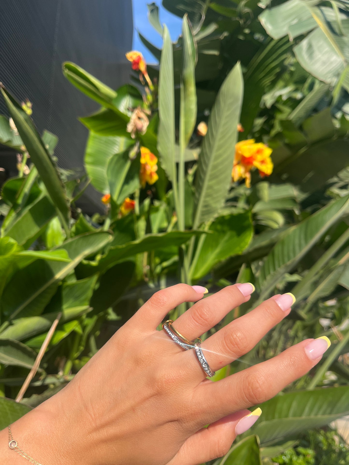 Outdoor shot of stacked rings in summer light – everyday luxury jewelry