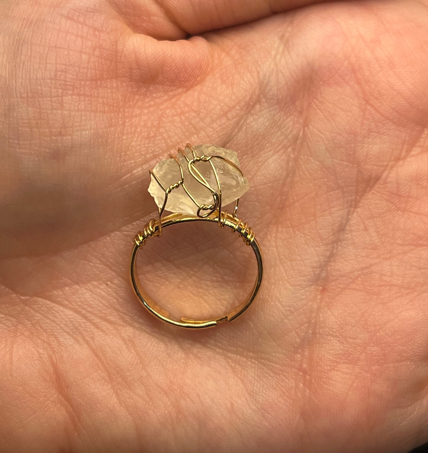 Sol Ring worn with other gold accessories on model hand