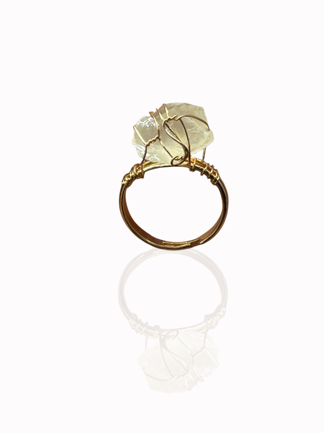 Sol Ring worn with other gold accessories on model hand