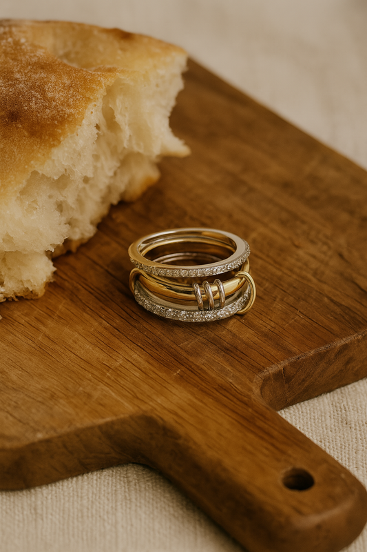 Trio ring stack on wooden surface with gold tones – Mediterranean sunlight

