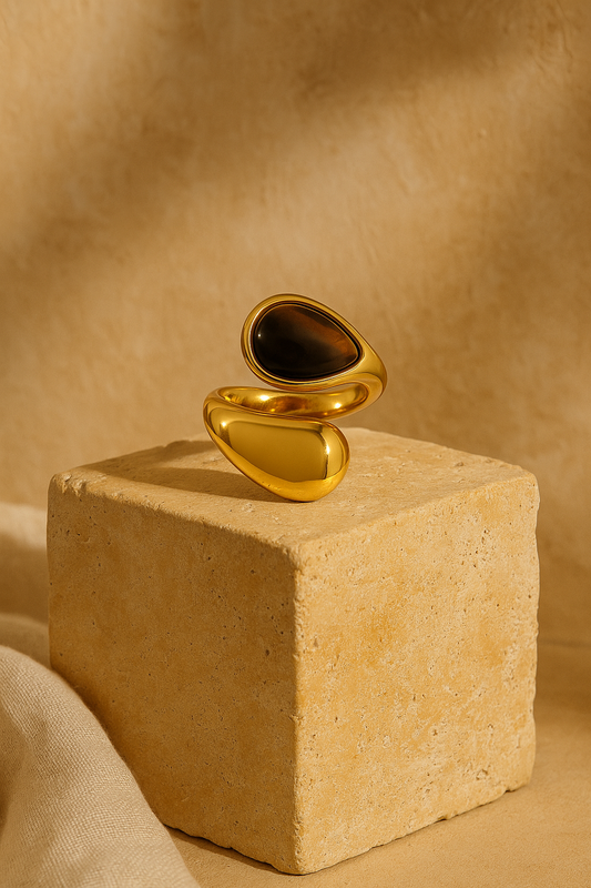 Sienna Ring 16k gold plated displayed on terracotta stone block
