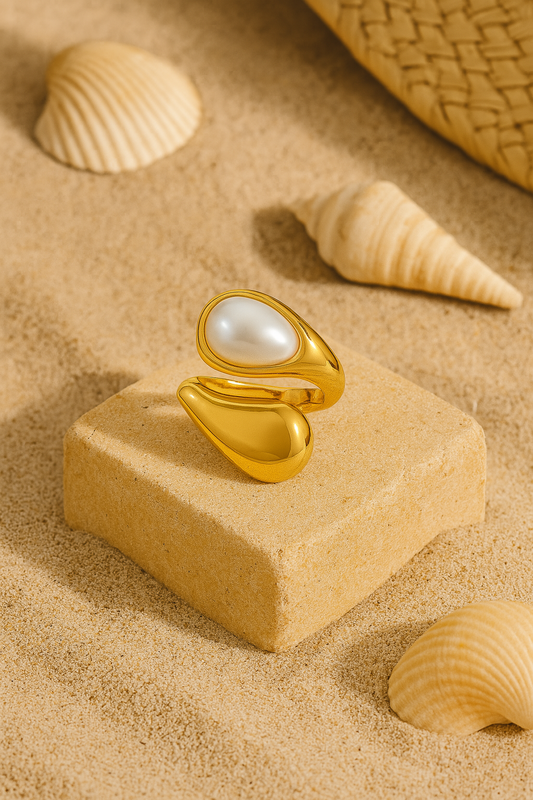 Sienna Blanc ring in white gold finish displayed on soft beach sand